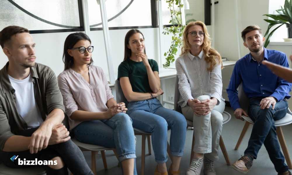 group of people listening to their boss