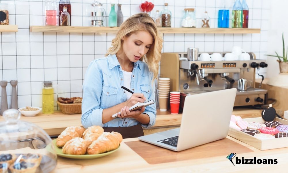 cafe owner taking notes