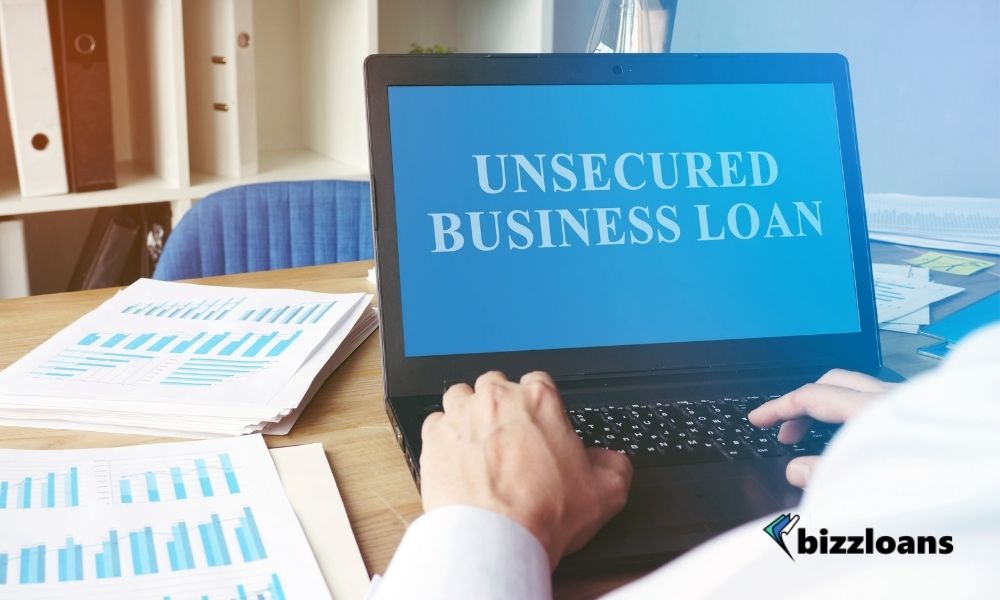man using laptop displaying unsecured business loan