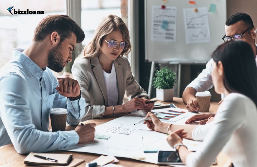 group of people discussing about small business loans in the office