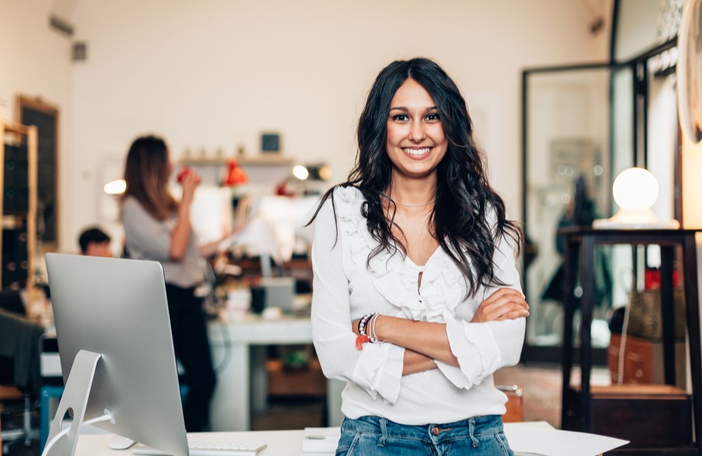 happy business owner in her shop