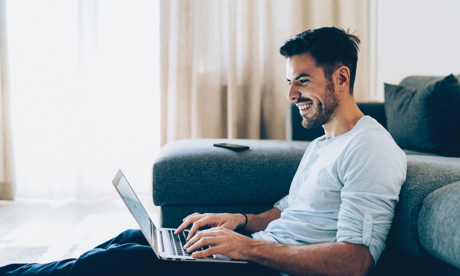 happy business man working on his laptop