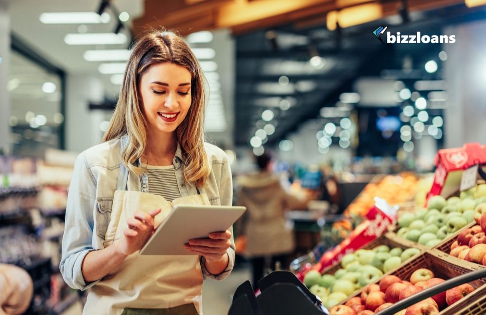 young business woman doing inventory in her grocery store