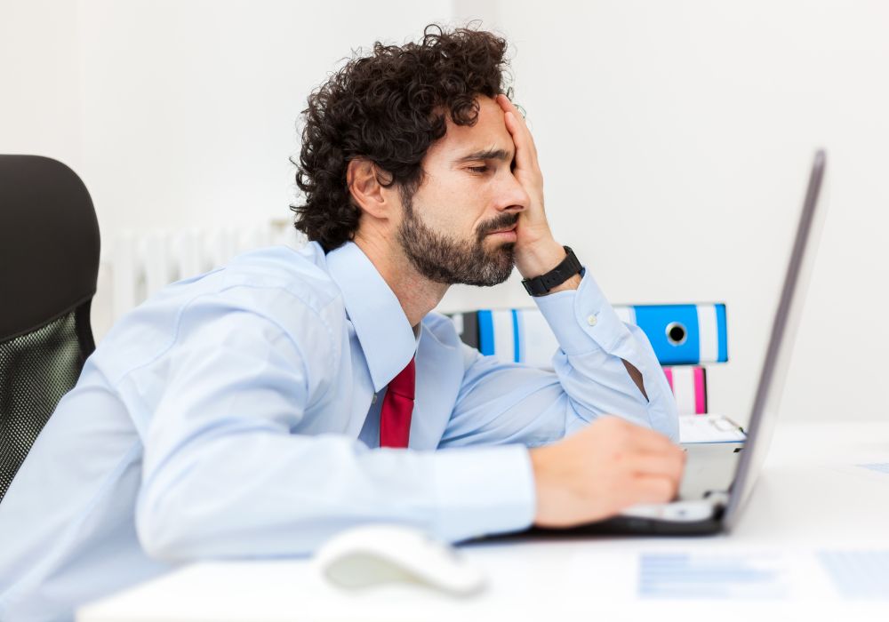 worried businessman on laptop 