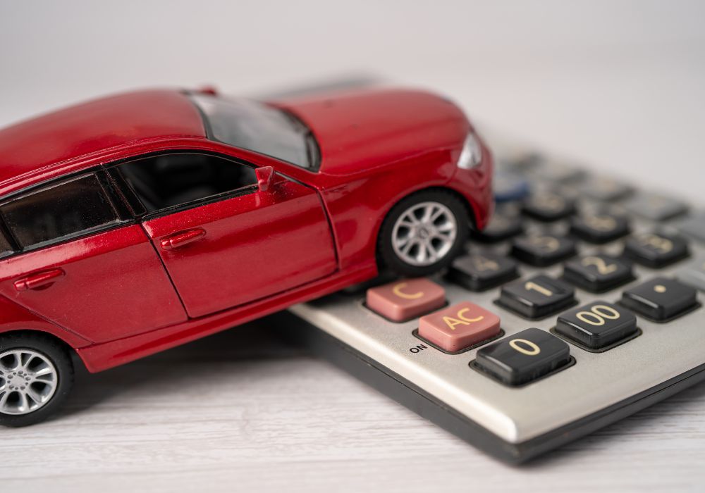vehicle on calculator; vehicle loan concept