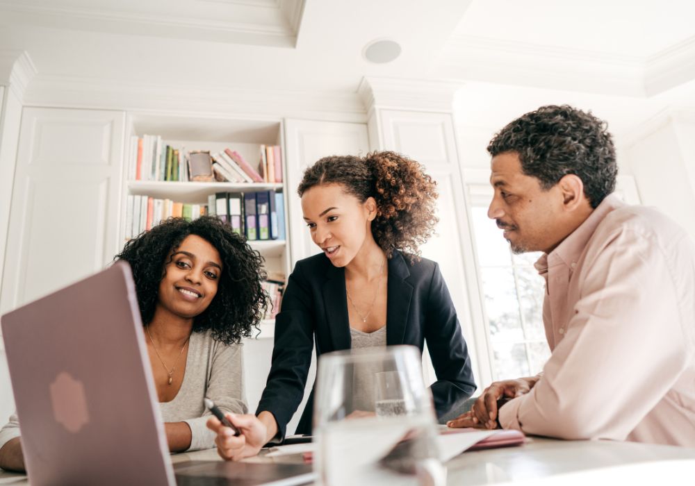 three business owners looking for a quick loan on laptop