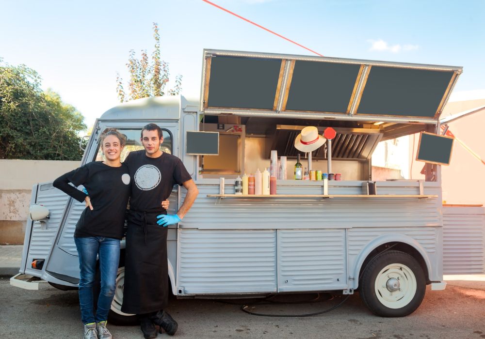 happy business owners in food truck